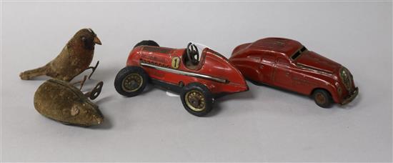 Two Schuco cars and two wind-up animals